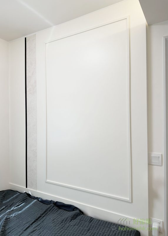 書房的黑色石紋護牆板營造專業氛圍，而主人房的簡約背景牆則帶來舒適與寧靜。